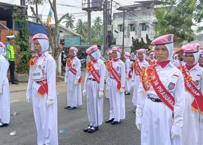 Kenakan Topi Pink, SD Negeri 38 Prabumulih Tampil Cantik di Gerak Jalan HUT RI ke-81